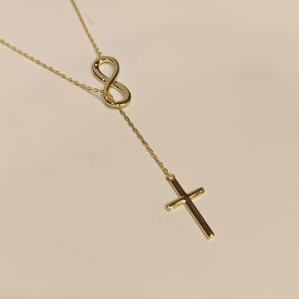 Cadenita con infinito y dije cruz | plata bañada en oro |