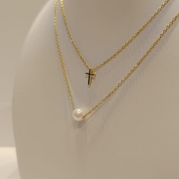 Conjunto doble con perla y cruz